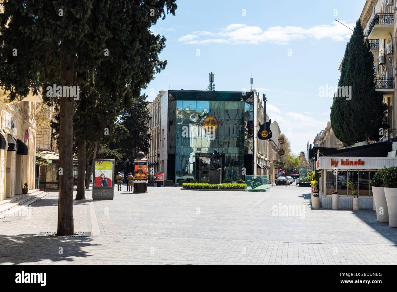 Baku, Azerbaijan – April 8, 2020. View of deserted Mammadamin Rasulzada street in Baku, toward Azerbaijan Cinema and Natavan Monument, in the wake of Stock Photo
