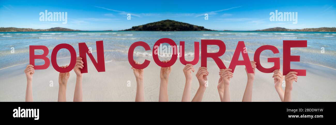 People Hands Holding Word Bon Courage Means You Can Do It Ocean Background Stock Photo Alamy