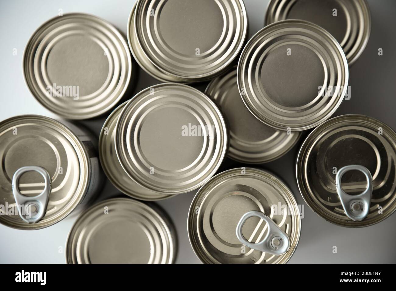 Stockpiling cans of different kind of food due to coronavirus outbreak and stay at home concept Stock Photo
