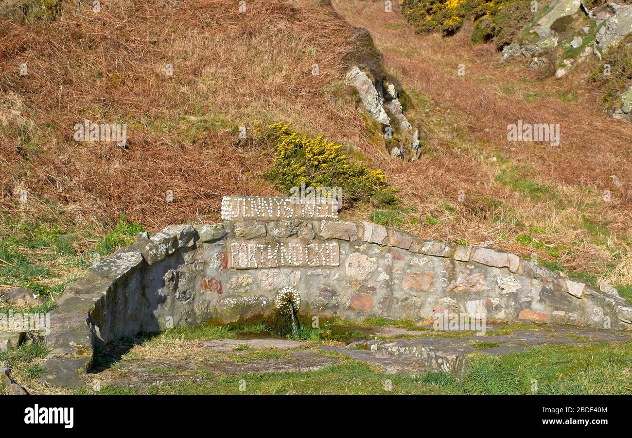 JENNYS WELL PORTKNOCKIE MORAY SCOTLAND AND HILLS COVERED IN YELLOW GORSE FLOWERS IN SPRING Ulex europaeus Stock Photo