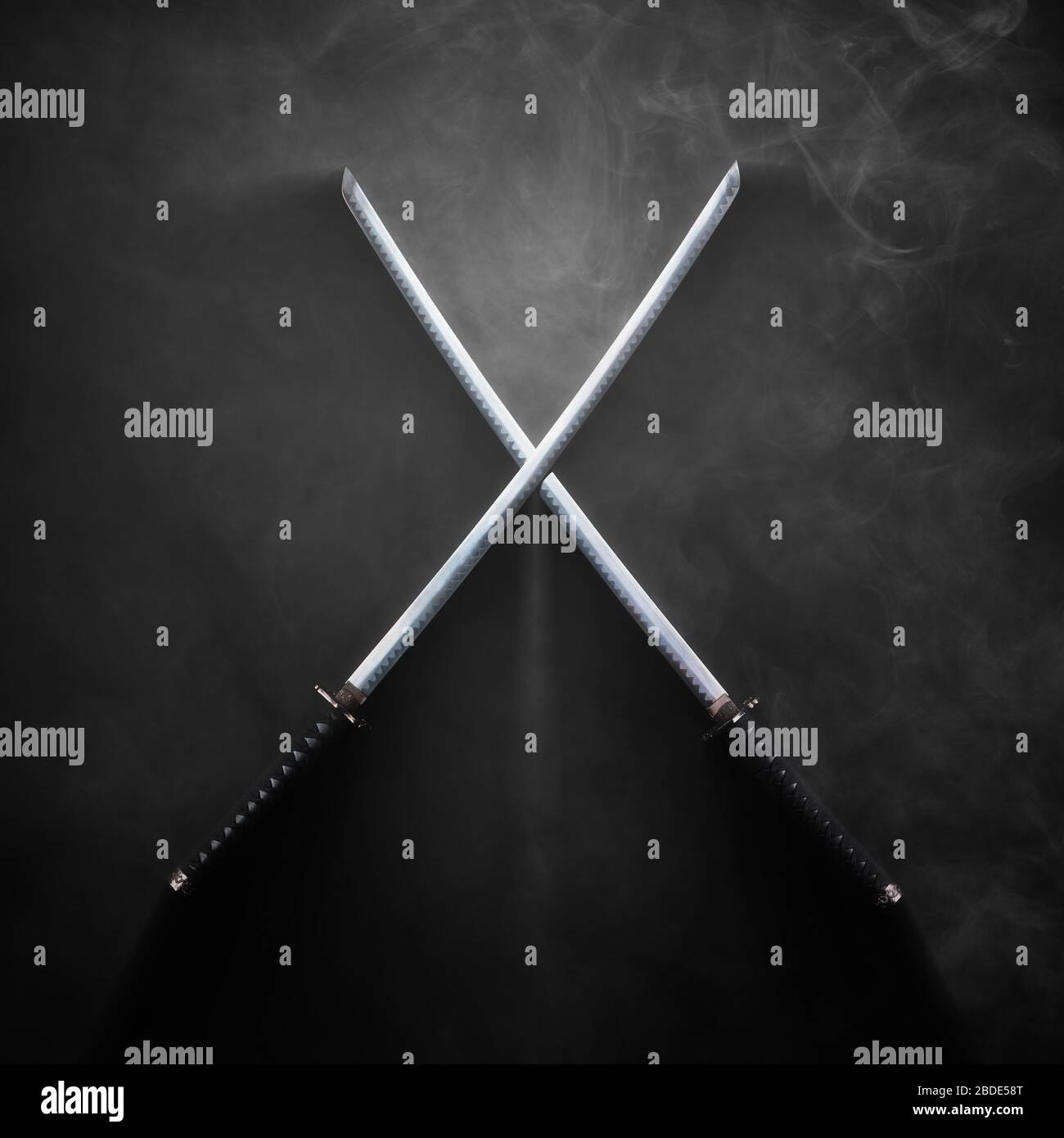 Dark image - Two katanas with crossed blades in dramatic smoke Stock Photo