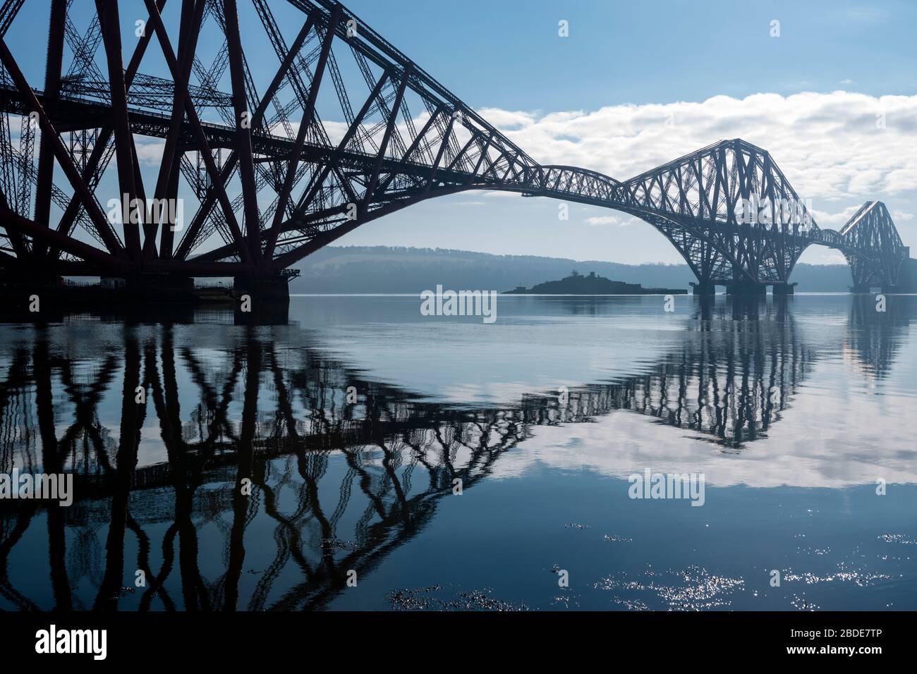 Forth Rail Bridge, with Inchgarvie island visible under span, viewed from the harbour on South Bay, North Queensferry in Fife, Scotland, UK Stock Photo