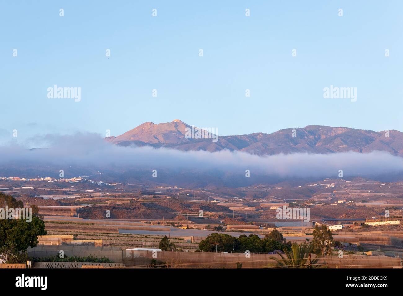Teide volcano and the Pico Viejo above the cloud, viewed from Playa San Juan, Tenerife, Canary Islands, Spain Stock Photo