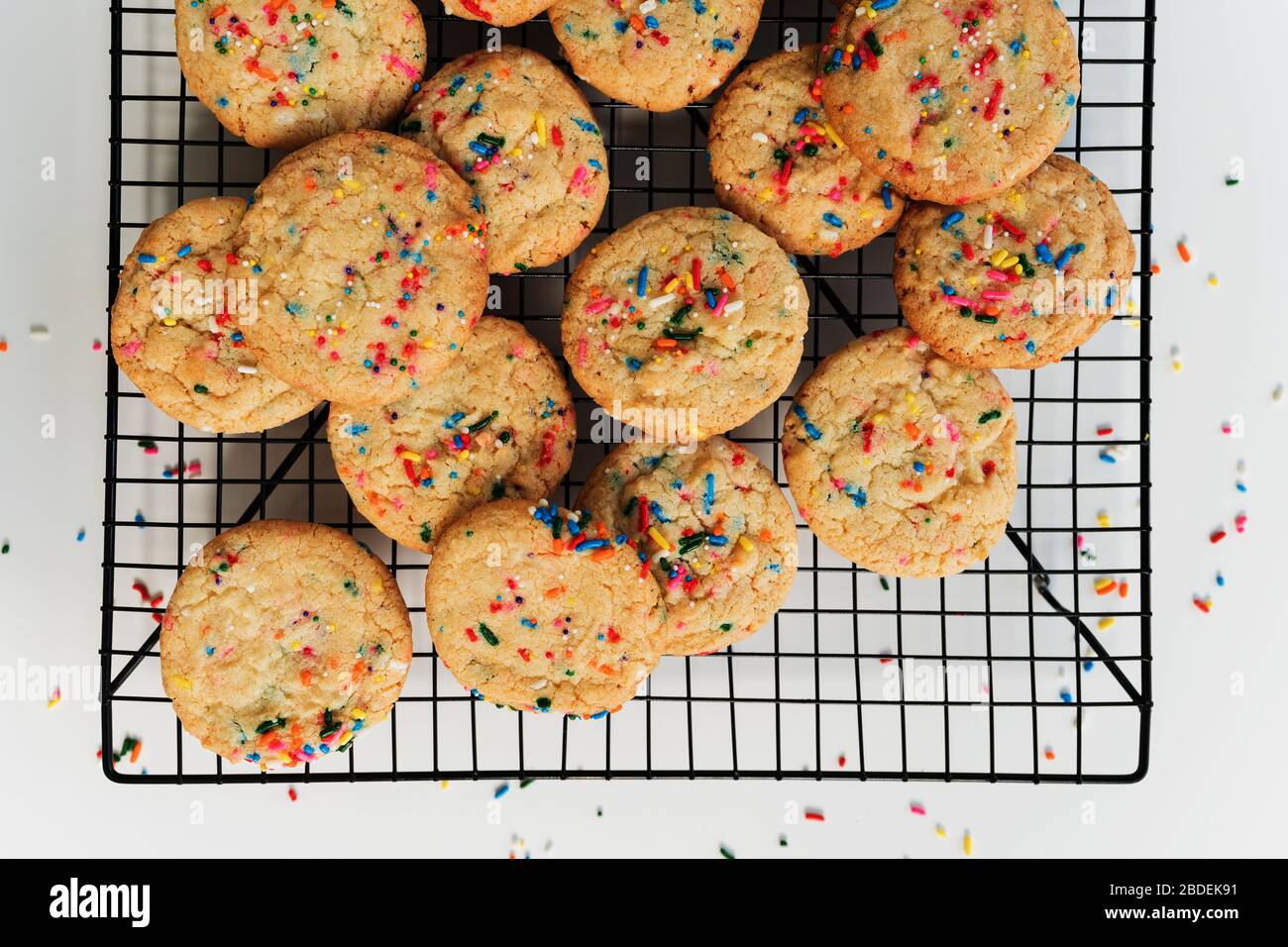 Homemade cookies with colorful sprinkleÂ on baking rackÂ Stock Photo