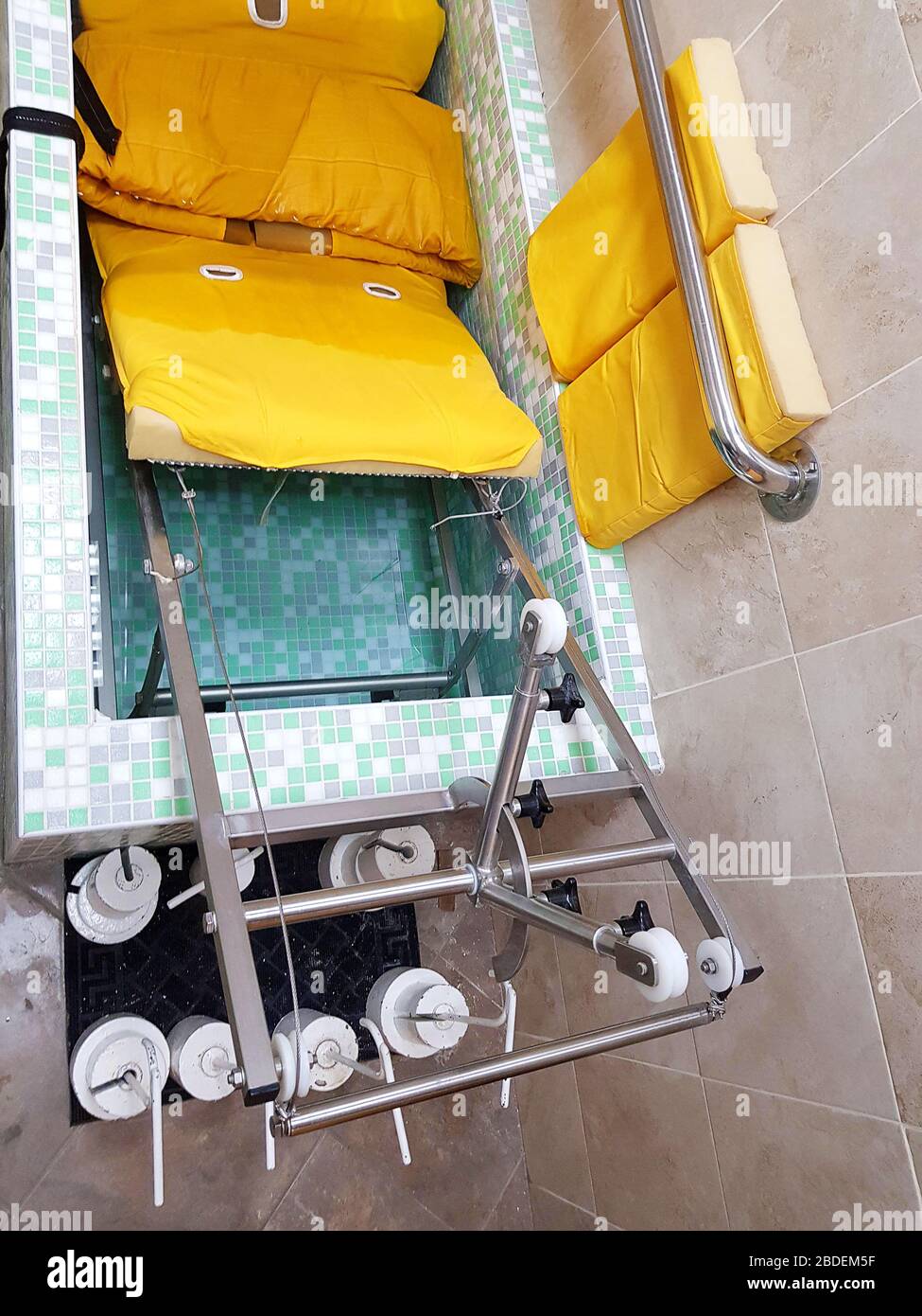 Universal apparatus for underwater extension of the spine in a rehabilitation clinic. Bathtub for extension of the spinal cord. Lumbar extension. Stock Photo