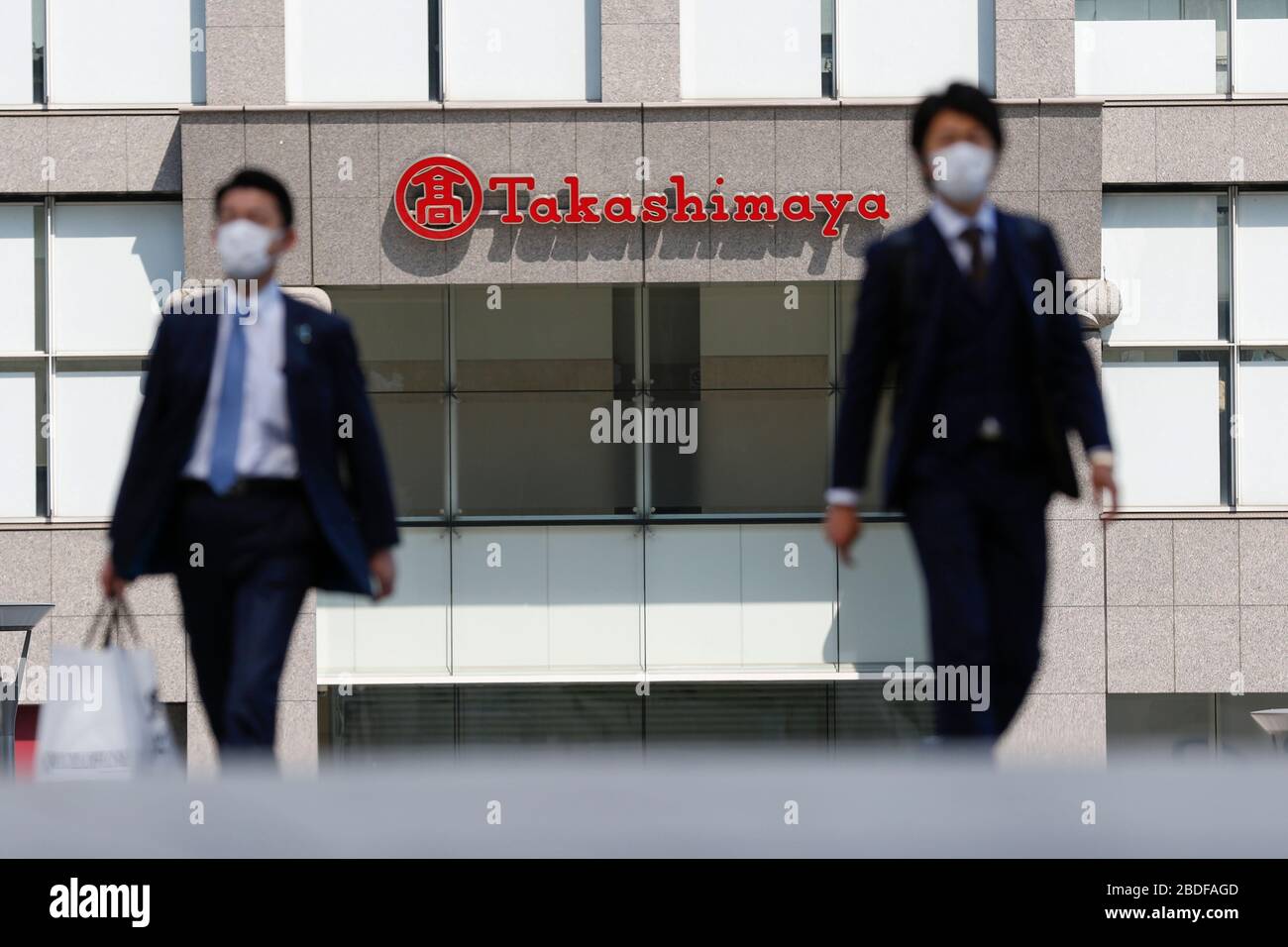 Tokyo, Japan. 8th Apr, 2020. Pedestrians walk past the department store Takashimaya Times Square in Shinjuku. Some stores in Tokyo has decided to close its doors temporarily after the Japanese Prime Minister Shinzo Abe declared a state of emergency for the capital and six other prefectures of Japan. Credit: Rodrigo Reyes Marin/ZUMA Wire/Alamy Live News Stock Photo