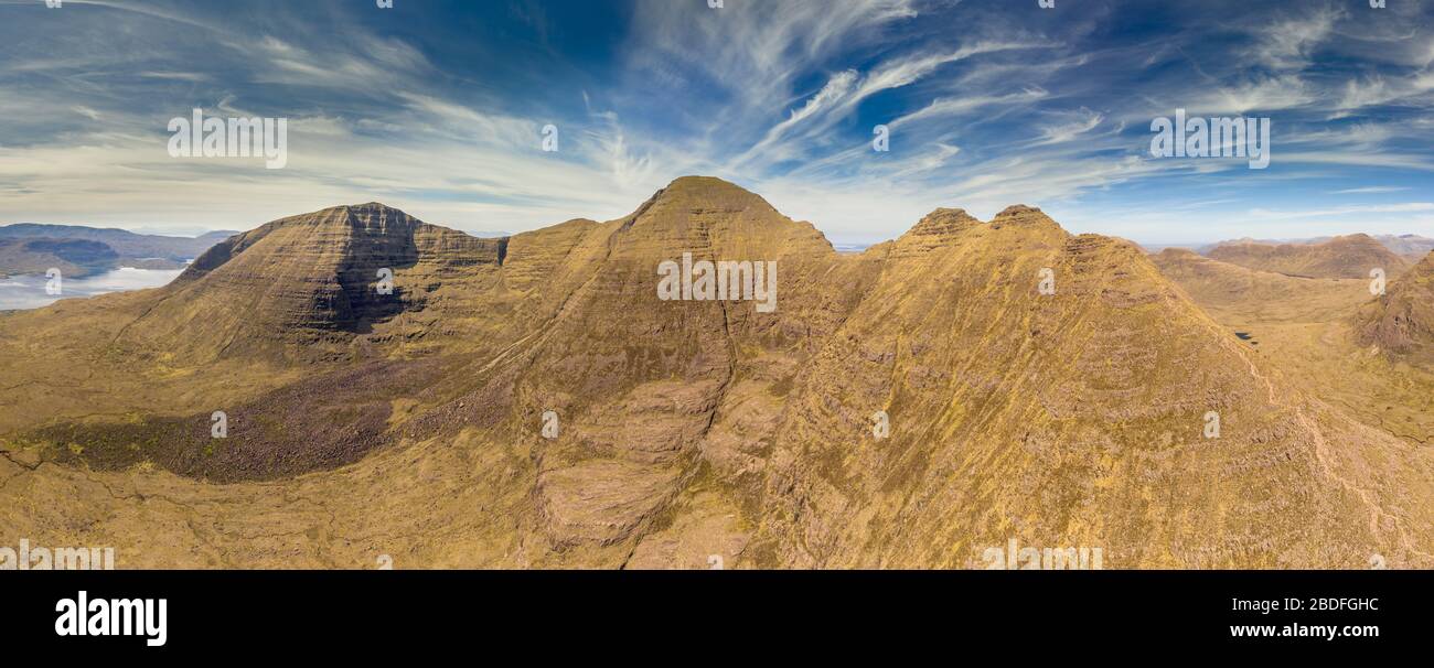 Beinn Alligin ridge aerial panorama in summer, showing Horns of Alligin - 'Na Rathanan' and main summits 'Sgurr Mor' and 'Tom na Gruagaich' Stock Photo