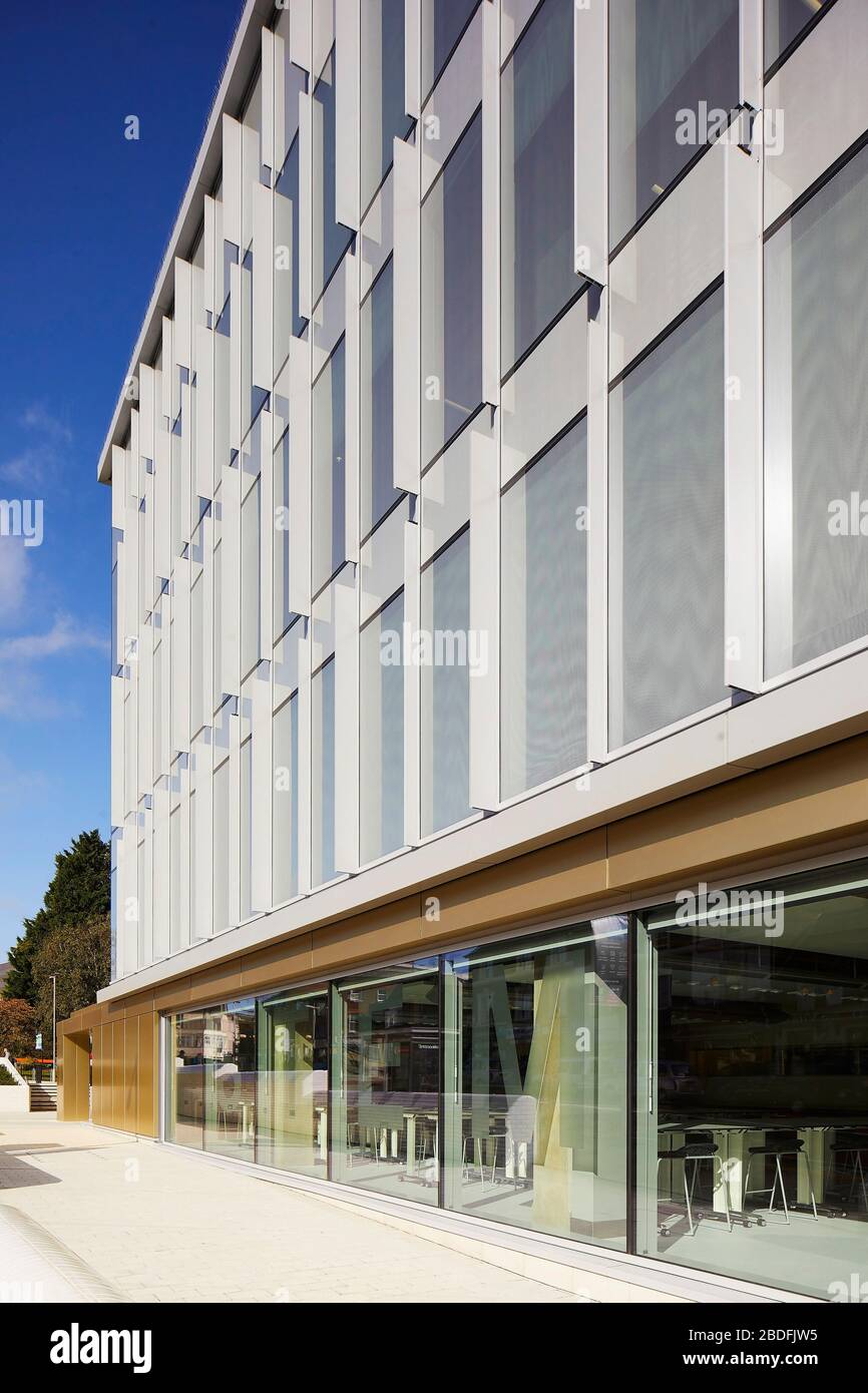 View along exterior facade with view through window on street level. STEM Building - University of Bedforshire, Luton, United Kingdom. Architect: MCW, Stock Photo