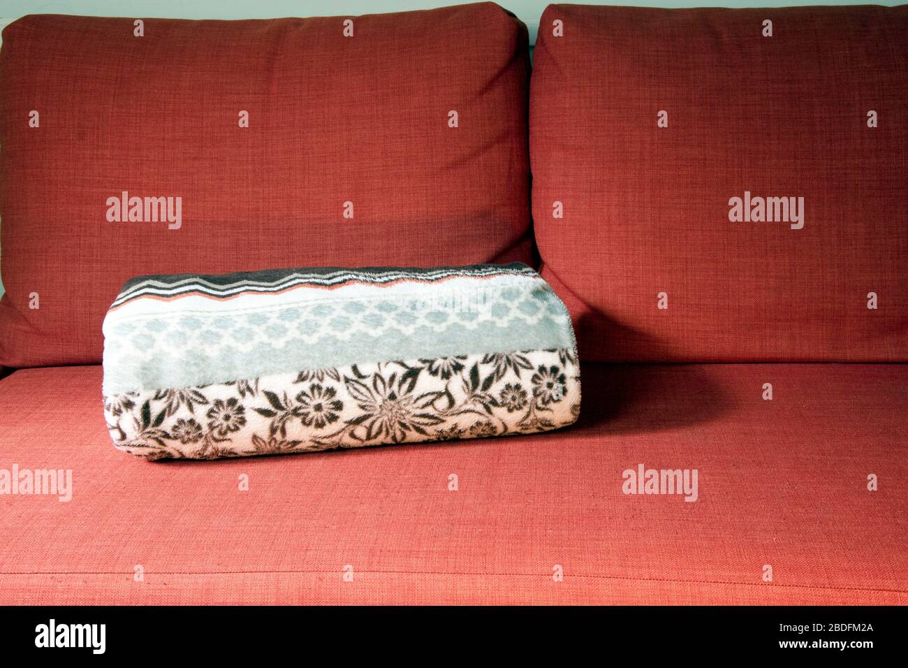 Orange Couch With Folded Blanket Earthy Colours Stock Photo Alamy