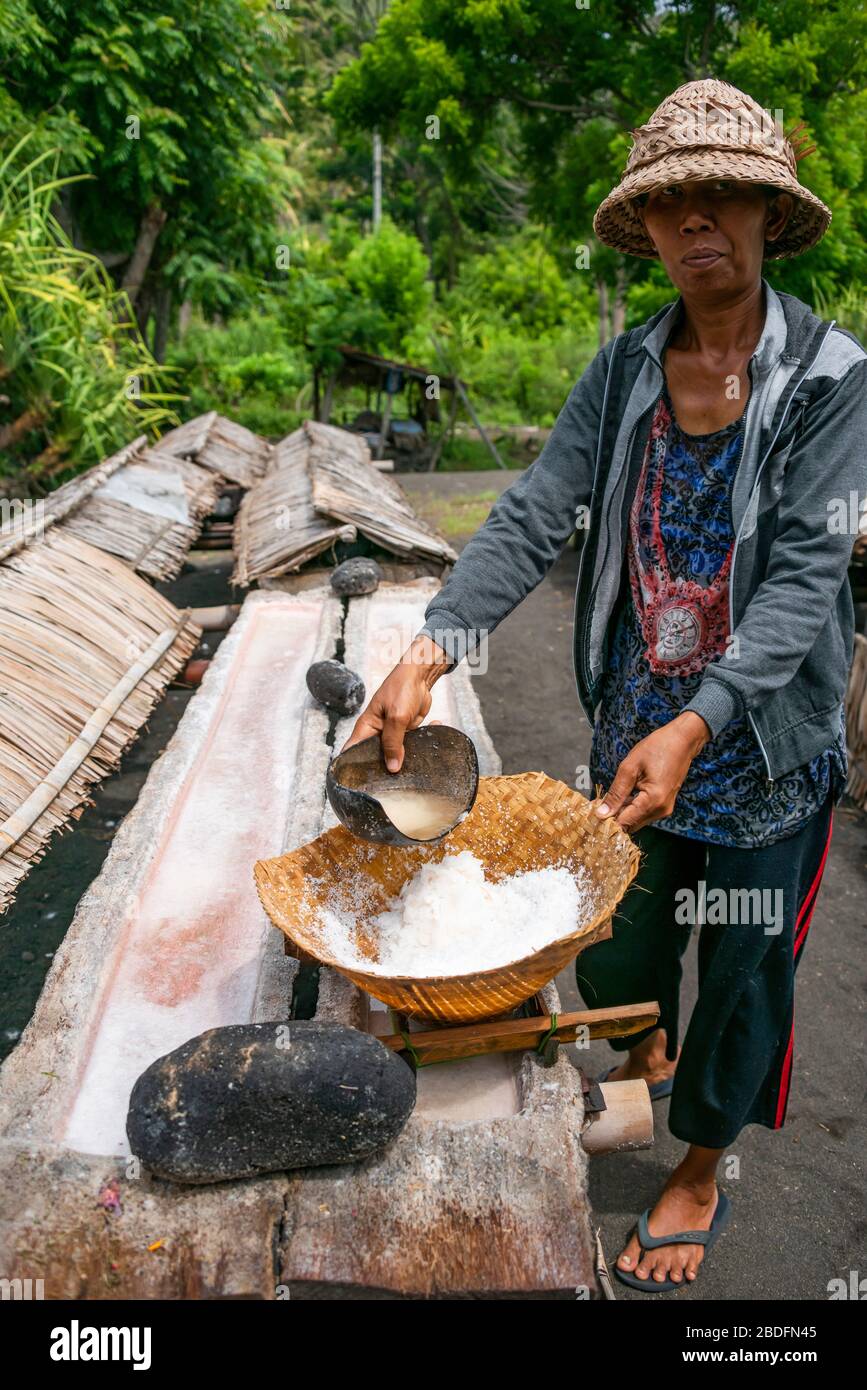 Vertical view of a traditional seasalt maker in Bali, Indonesia. Stock Photo