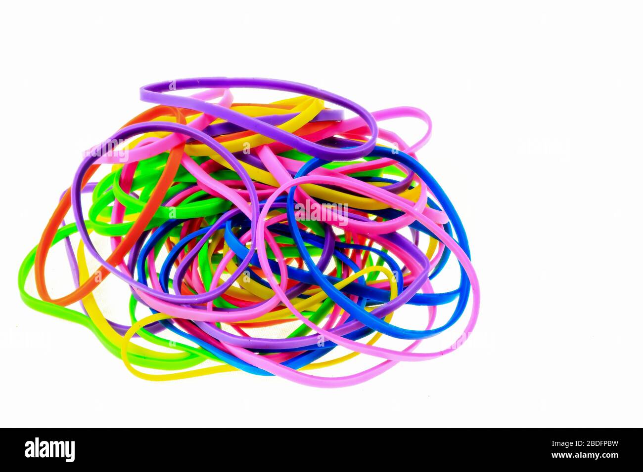 A frame of multi-colored colorful rubber bands for hair, combs and hair  clips on a black background.Copy space Stock Photo - Alamy