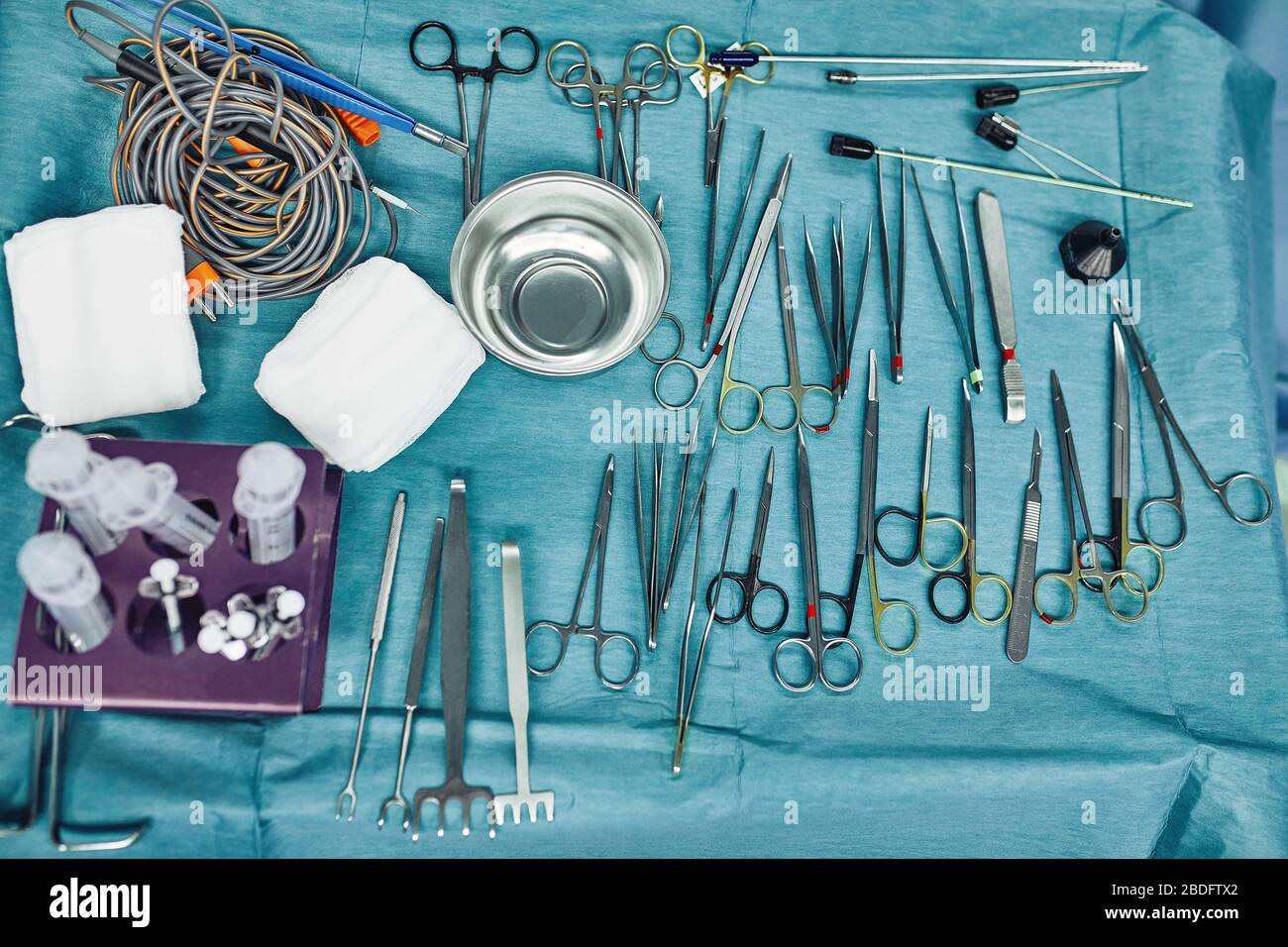 Surgical instruments in the operating room, laid out on a sterile table on  a special blue tissue. The concept of medecine, surgery, sterile area Stock  Photo - Alamy