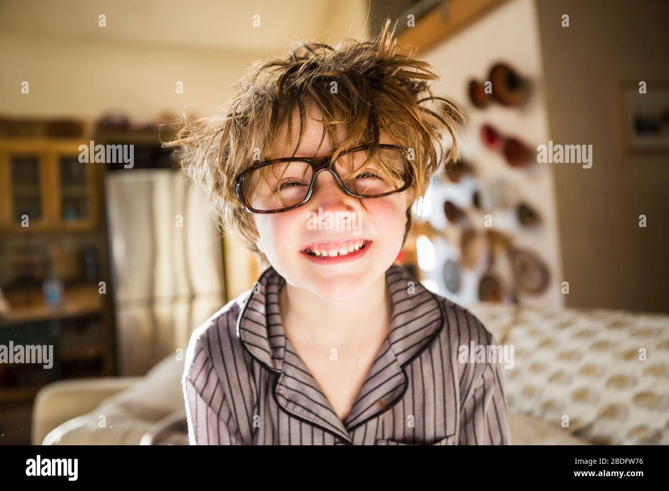 Portrait of a six year old boy with disheveled hair and oversized glasses waking up. Bedhead hair Stock Photo - Alamy Portrait of a six year old boy with disheveled hair and oversized glasses waking up. Bedhead hair Stock Photo - Alamy