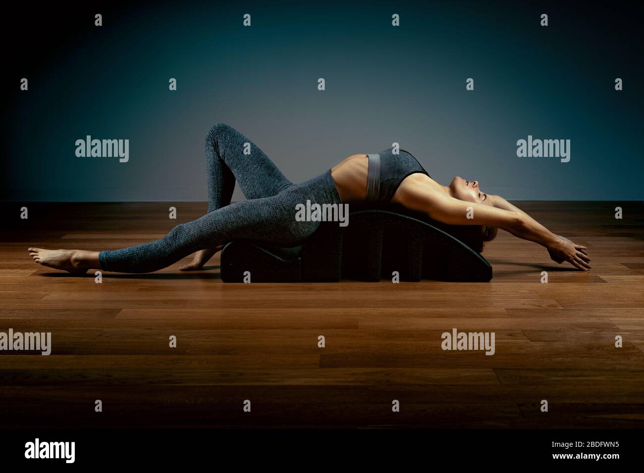 The reformer simulator, the girl the Pilates trainer does exercises for