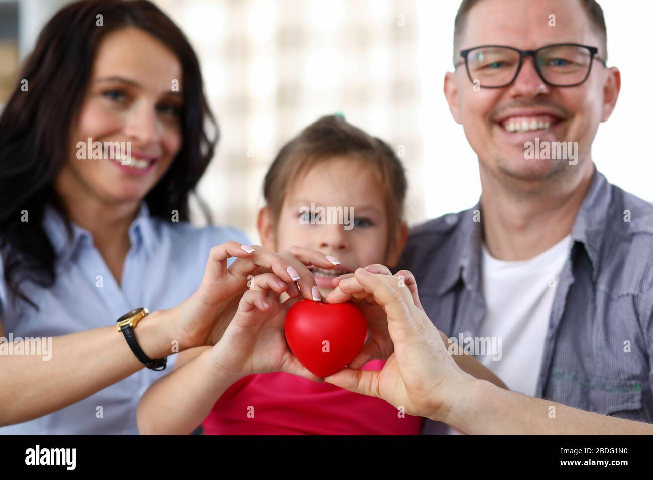 Smiling parents with kid Stock Photo