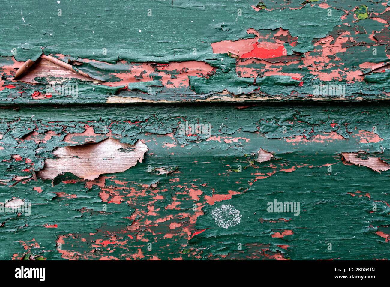 Peeling paint on boards exposing previous colour scheme/undercoat Stock Photo Alamy