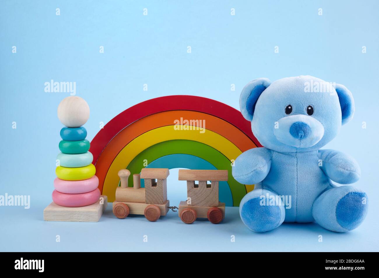 Baby toys collection on blue pastel color background. Education concept