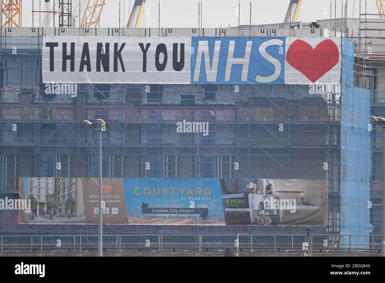 A Thank You NHS banner on a building near the NHS Nightingale Hospital at the ExCel centre in London, a temporary hospital with 4000 beds which has been set up for the treatment of Covid-19 patients. Stock Photo