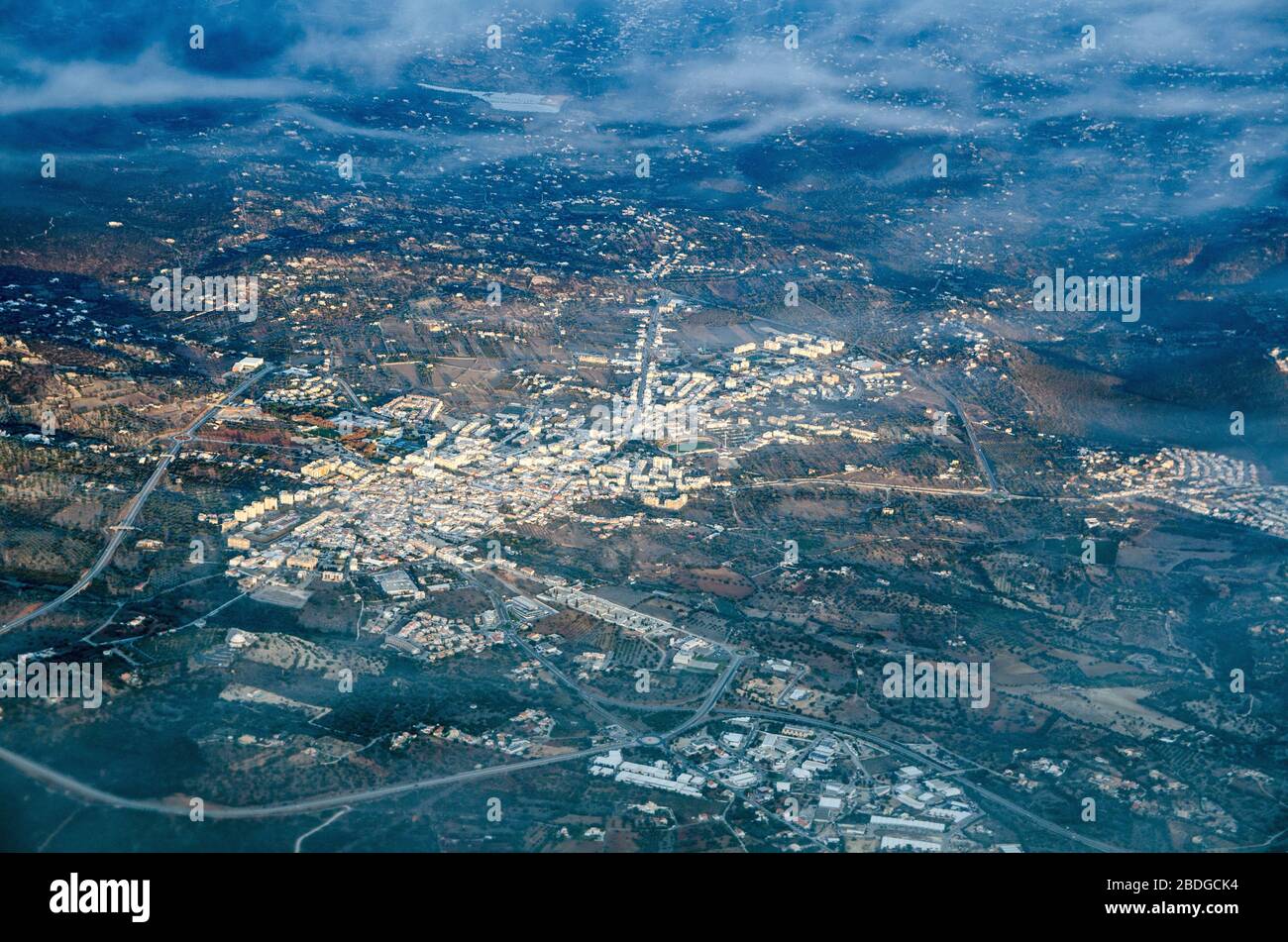 Aerial view of the town of Cassima in the Loule area of Portugal.  The Estadio Municipal de Loule is towards the top of the town. Stock Photo