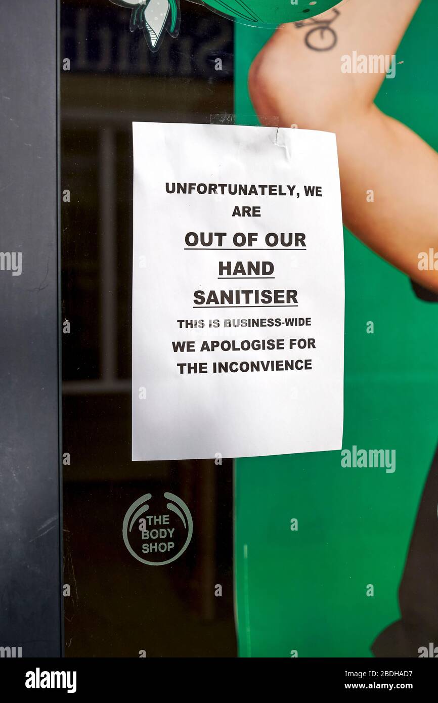 Notice in Body Shop window advising hand sanitiser out of stock Stock Photo