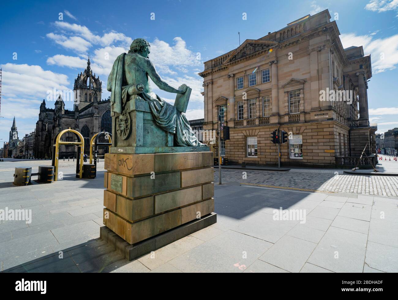 Empty Royal Mile at David Hume Statue during coronavirus pandemic and lockdown, in Edinburgh, Scotland, UK Stock Photo