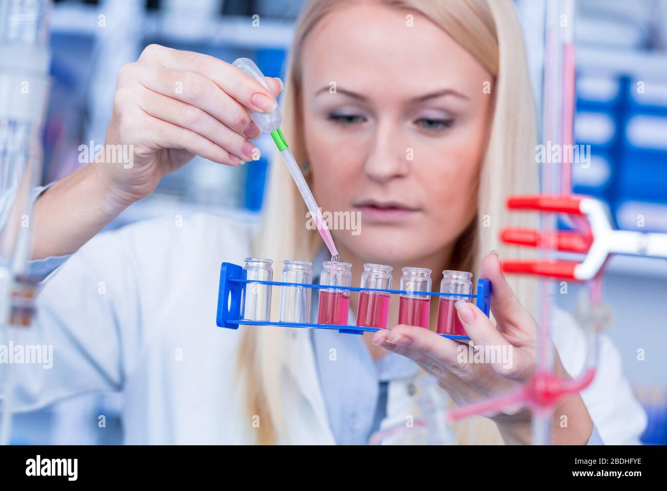 Girl laboratory Assistant works with an antiviral drug in a