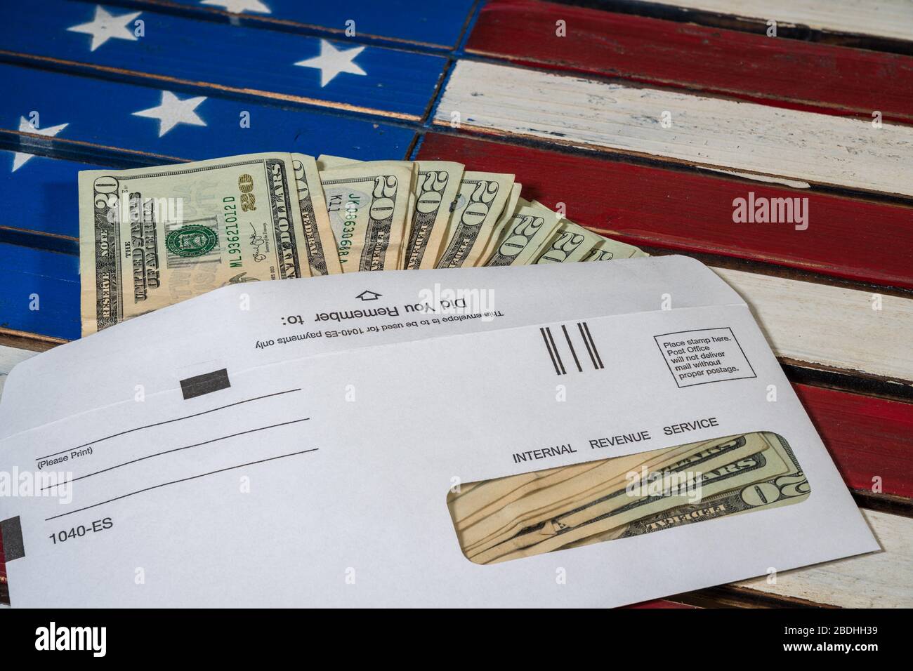 Stack of 20 dollar bills in IRS envelope to illustrate coronavirus stimulus payment or estimated tax payments Stock Photo