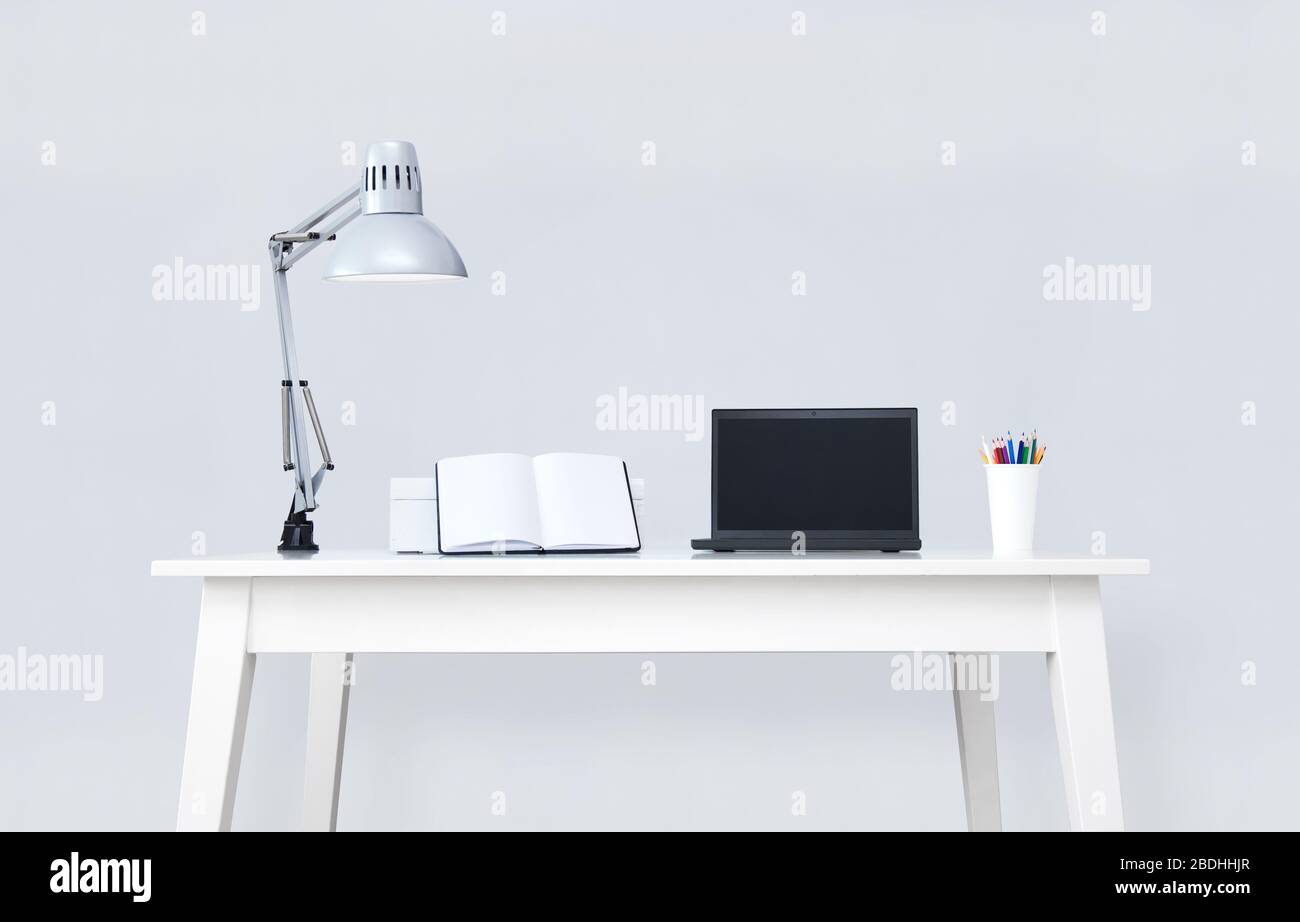 Clean white desk with computer and notebooks Stock Photo Alamy
