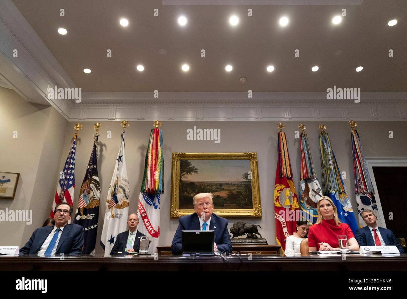 U.S. President Donald Trump, joined by Treasury Secretary Steven Mnuchin, presidential daughter Ivanka Trump, and Director of the National Economic Council Larry Kudlow, participates in a video conference with banking executives on small business relief  in the Roosevelt Room of the White House April 7, 2020 in Washington, DC. Stock Photo