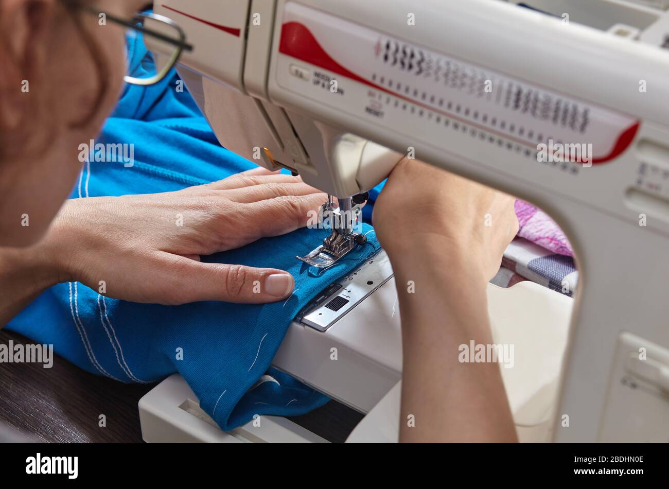 Tailoring Process Women's hands behind her sewing Stock Photo Alamy