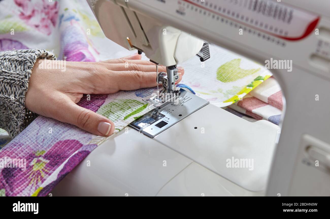 Tailoring Process Women's hands behind her sewing Stock Photo Alamy