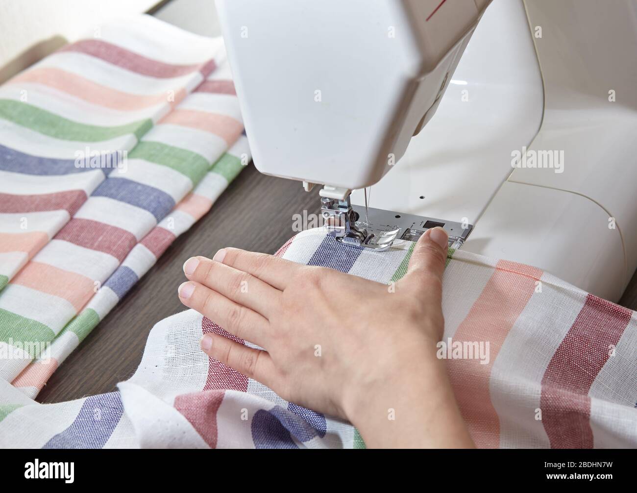 Tailoring Process Women's hands behind her sewing Stock Photo Alamy