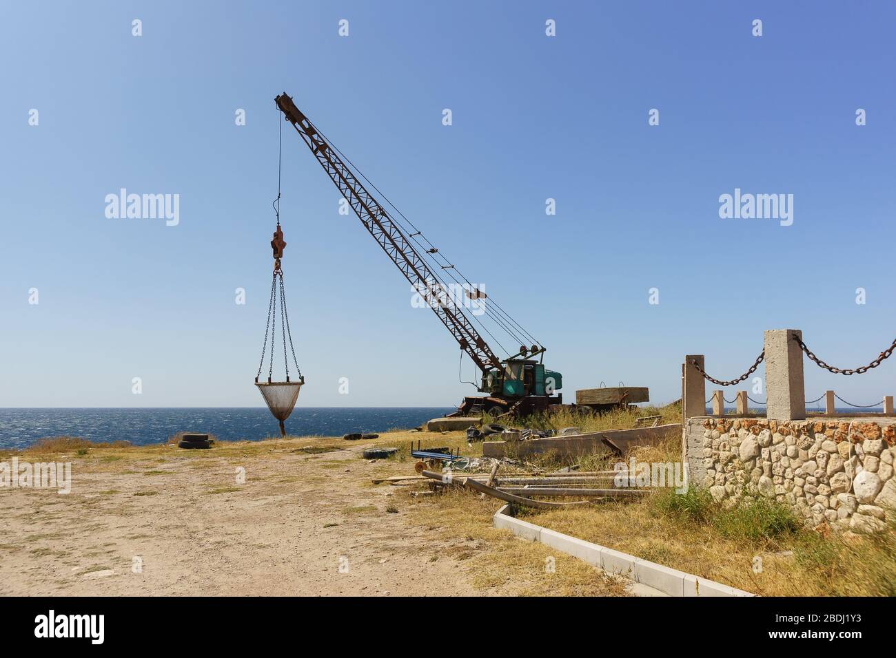 Crane lifting small boat hi-res stock photography and images - Alamy