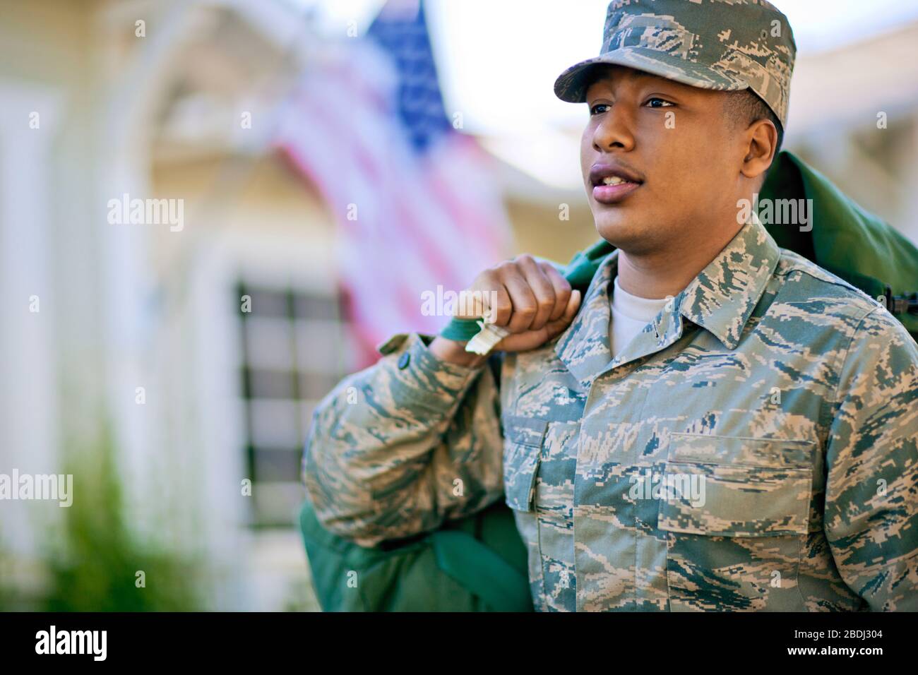 Soldier carrying a bag over his shoulder Stock Photo Alamy
