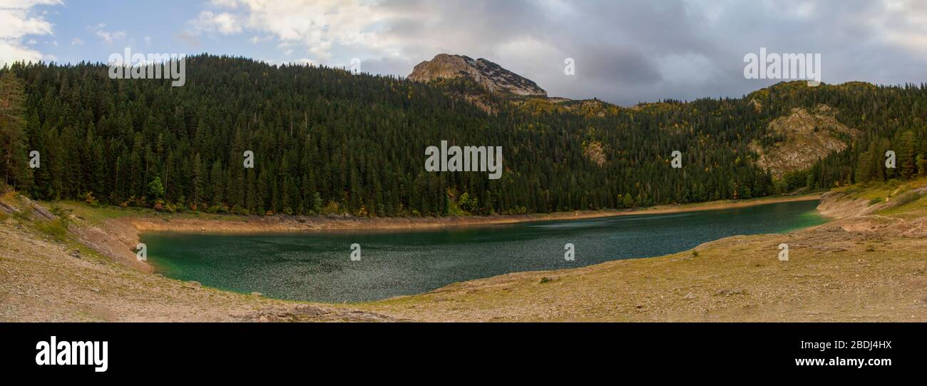 Different views of the glacial Black lake (Crno jezero), forest and mountains around in the national park Durmitor in Montenegro, Europe Stock Photo