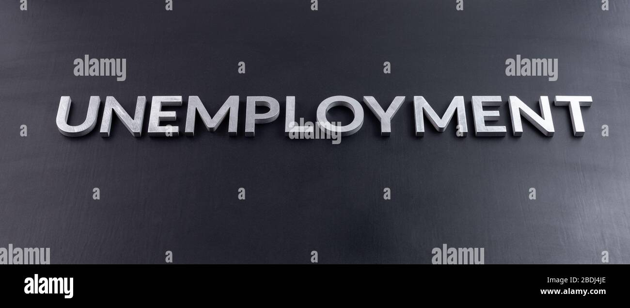 the word unemployment laid with aluminium letters on matte black flat surface Stock Photo