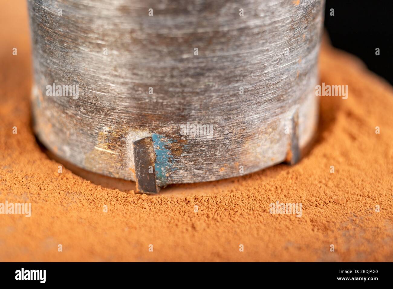Drilling a large hole in red brick. Construction works in the home