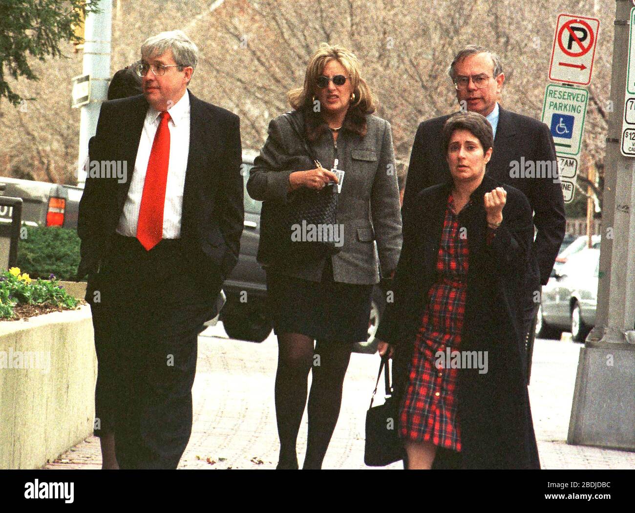 Arlington, VA - March 3, 1999 -- Linda Tripp (wearing a gray jacket) with unidentified people on Wilson Blvd in front of the building where she now works on 3 March, 1999.Credit: Ron Sachs/CNP (RESTRICTION: NO New York or New Jersey Newspapers or newspapers within a 75 mile radius of New York City) | usage worldwide Stock Photo