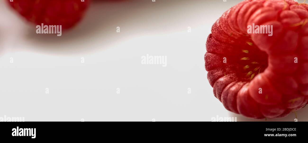 Raspberry fruit single and group food portrait on plain background ...