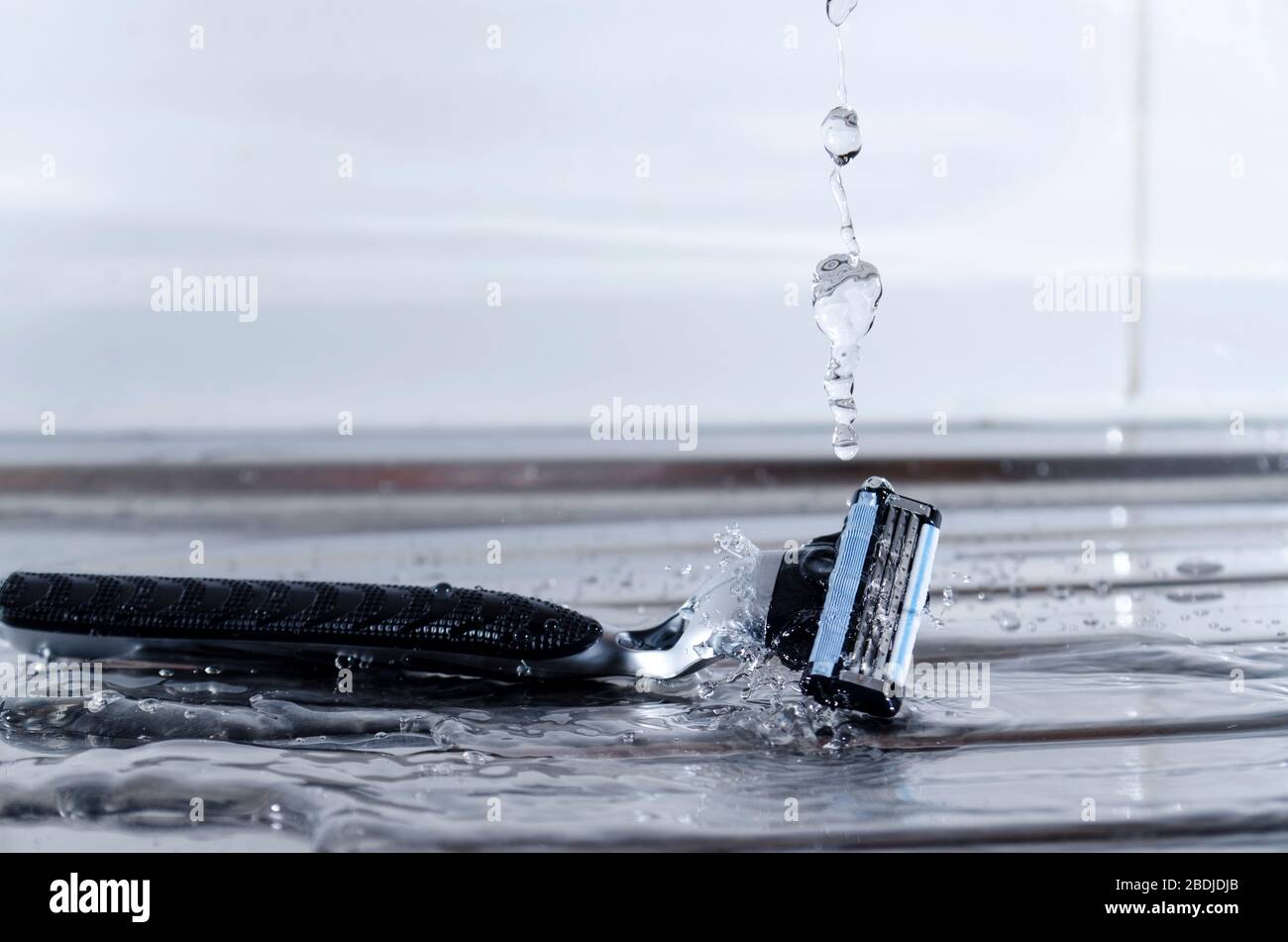 Razor Splashing into Water Stock Photo Alamy