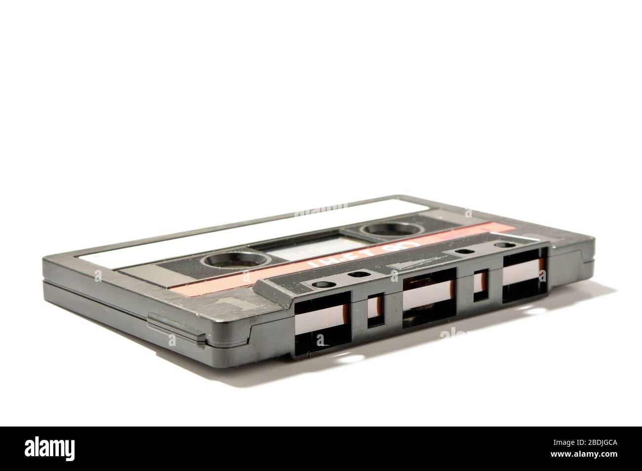Audio cassette with magnetic encoded information isolated on the white background Stock Photo