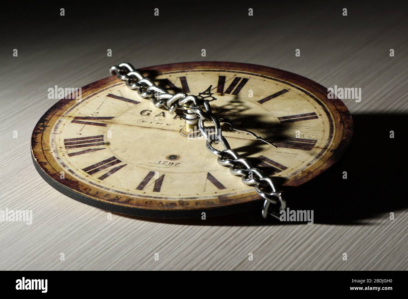 Clock with metal circuit. Concept of stopping time Stock Photo Alamy