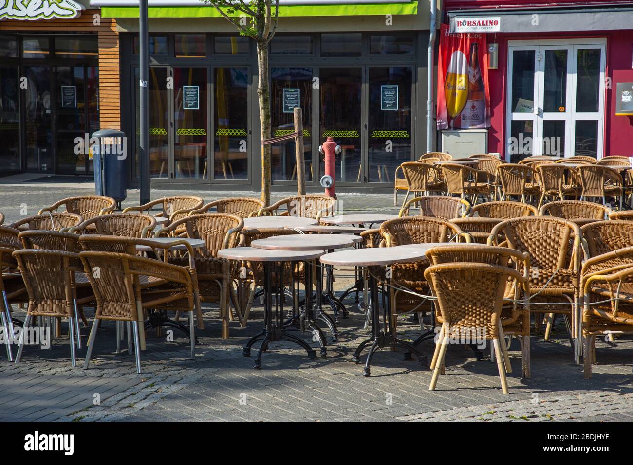 Neuwied, Germany - April 8, 2020: closed pub "Borsalino" with empty chairs  and tables in front based on Corona pandemic Stock Photo - Alamy