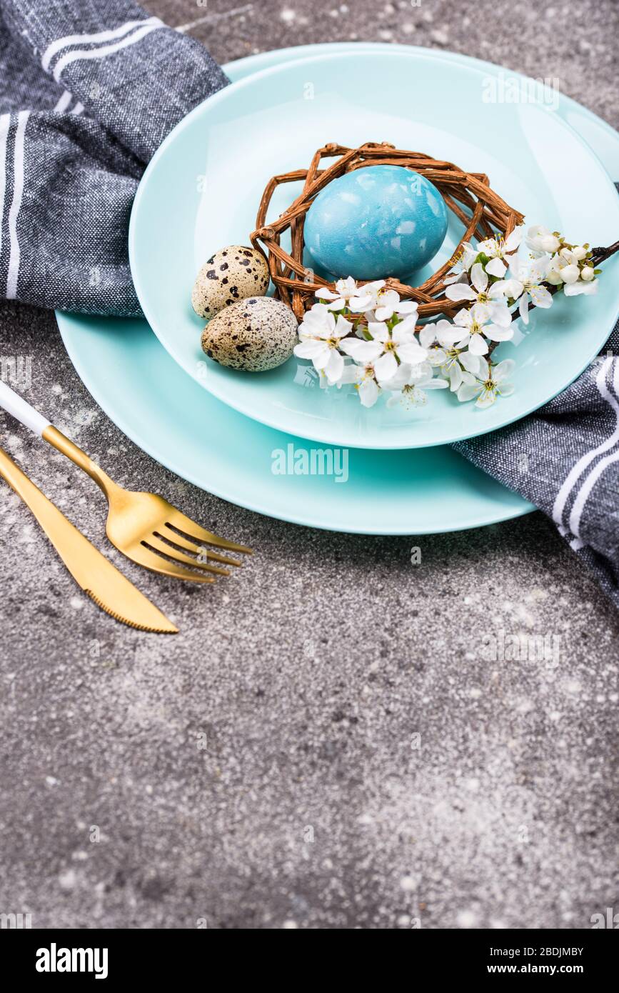 Easter table setting with blue egg Stock Photo