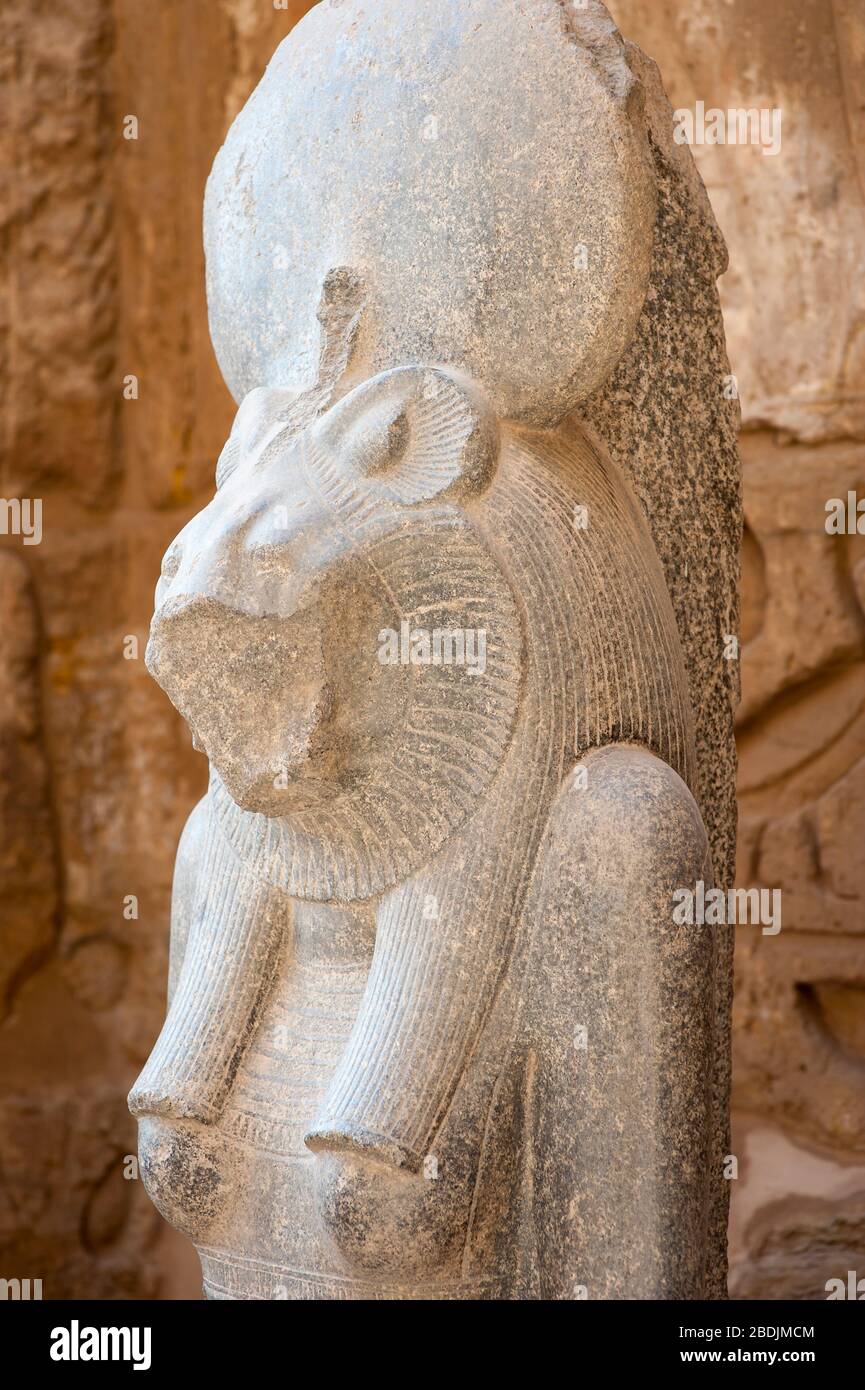 Close up portrait of an Egyptian sekhmet lioness warrior goddess, also a deity of healing and fertility, at Medinet Habu, West Bank, Luxor, Egypt Stock Photo