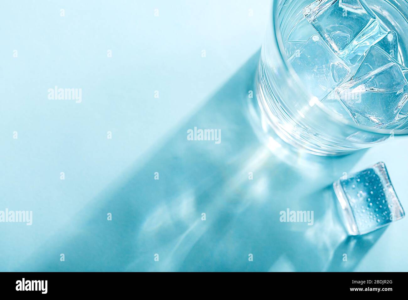 Colored banner with fresh ice cubes and reflections Stock Photo