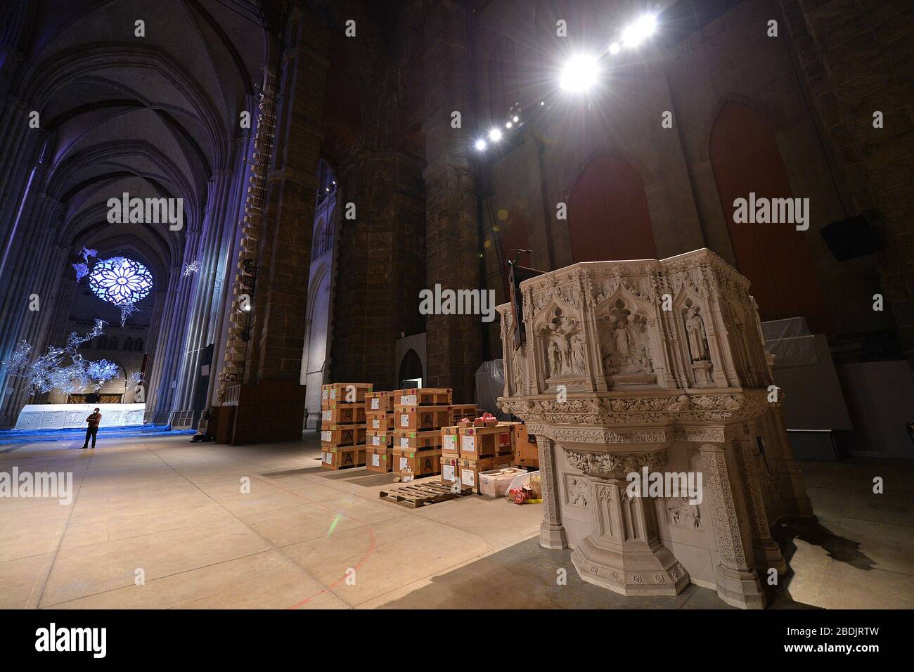 New York City, USA. 08th Apr, 2020. The first of several tents is erected inside the great gothic Cathedral of St. John the Devine as it is transformed into an emergency Coronavirus field hospital by Samaritan's Purse in New York, NY, April 8, 2020. The 600-foot long cathedral is partnering with Mount Sinai Morningside Hospital to have 400 beds to treat COVID-19 patients. (Anthony Behar/Sipa USA) Credit: Sipa USA/Alamy Live News Stock Photo