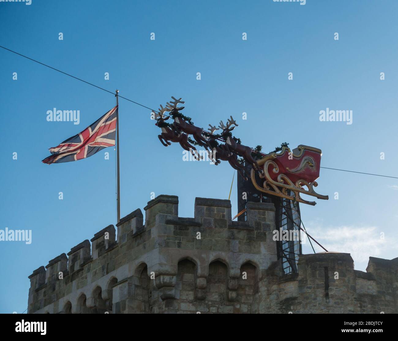 Southampton / UK - 14th December 2019: A shot of reigndeer pulling a sleigh atop the bargate in Southampton city centre at Christmastime. Stock Photo