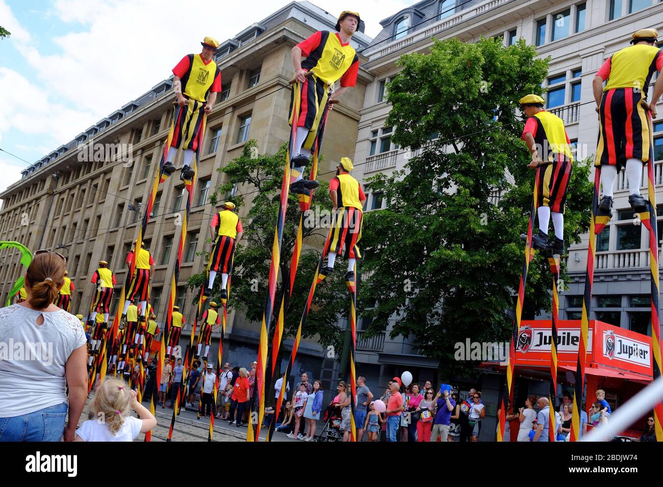 Stilt walkers in medieval style costume in the Belgian National Day parade.Brussels.Belgium Stock Photo