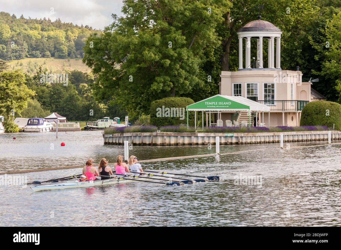 Rowers pass Temple Island, Henley-on-Thames, Oxfordshire, England, GB, UK Stock Photo